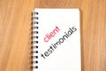 Client testimonials text concept on notebook Royalty Free Stock Photo