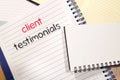 Client testimonials text concept on notebook Royalty Free Stock Photo