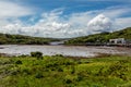 Clifden bay at low tide with boats anchored on the pier Royalty Free Stock Photo