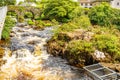 Clifden waterfalls with regular water flow on the Owenglin or Owenglen river Royalty Free Stock Photo