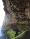 Cliff cave under a waterfall, Iceland