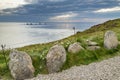 Cliff edge boulders and shafts of sunlight shining through clouds at sunset,Land`s End,Cornwall,England,UK Royalty Free Stock Photo