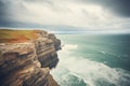 cliff edge overlooking a stormy ocean Royalty Free Stock Photo