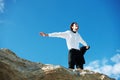 Cliff, freedom or happy business man in celebration of success or victory on holiday vacation. Sky background, goal or