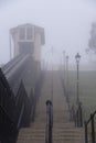 Cliff Lift funicular railway rising up cliff gardens on a cold, foggy frosty morning Royalty Free Stock Photo
