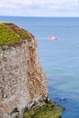 Cliff off Flamborough Head with boat Royalty Free Stock Photo