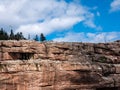 Cliff of rock mountain with thousands of northern gannets Bonaventure Island Gaspesie, Quebec, Canada Royalty Free Stock Photo