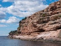 Cliff of rock mountain with thousands of northern gannets Bonaventure Island Gaspesie, Quebec, Canada Royalty Free Stock Photo