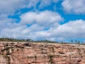 Cliff of rock mountain with thousands of northern gannets Bonaventure Island Gaspesie, Quebec, Canada Royalty Free Stock Photo