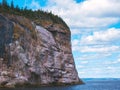 Cliff of rock mountain with thousands of northern gannets Bonaventure Island Gaspesie, Quebec, Canada Royalty Free Stock Photo