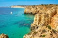 Cliff rocks and sea bay with turquoise water in Lagos, Algarve region, Portugal Royalty Free Stock Photo