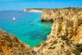 Cliff rocks and sea bay with turquoise water in Lagos, Algarve region, Portugal Royalty Free Stock Photo