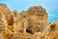 Cliff rocks and sea bay with turquoise water in Lagos, Algarve region, Portugal Royalty Free Stock Photo