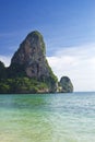 Mountain cliff at the island sea beach with clear blue sky background landscape