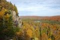 Cliff and small lake surrounded by trees in fall color in northern Minnesota Royalty Free Stock Photo