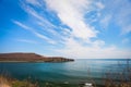 Cliff on spring time with the deep blue sea and sky with clouds Royalty Free Stock Photo