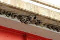 Cliff swallow nests made of mud under a bridge overhang