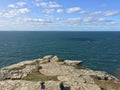 Cliff at Tintagel castle in Cornwall, England with the Atlantic Ocean coastline., UK, England Royalty Free Stock Photo