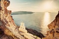 Cliff, volcanic rocks and a traditional chapel on Santorini island, Greece Royalty Free Stock Photo