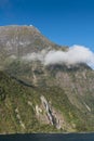 Cliff with waterfall in Milford Sound, New Zealand. Royalty Free Stock Photo