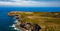 Cliffs At Atlantic Coast With Ancient Lighthouse At Cap Frehel In Brittany, France Phare du Cap Frehel Royalty Free Stock Photo