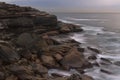 Cliffs and boulders meet the sea Royalty Free Stock Photo