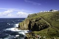 Cliffs and breaking waves at Lands End in Cornwall Royalty Free Stock Photo