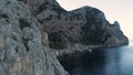 Cliffs at the calm dark blue sea on clear sky background, Ireland. Shot. Huge mountains covered by green plants and the Royalty Free Stock Photo