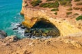 cliffs on the famous Benagill beach in Portugal, waves crashing on cliffs, the raging ocean .