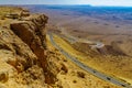 Cliffs, landscape, and hairpinned road in Makhtesh crater Ramon