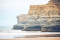 cliffs with layers of sedimentary rock by the sea Royalty Free Stock Photo