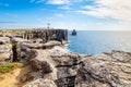 Cliffs and lighthouse of Carvoeiro cape in Peniche Royalty Free Stock Photo