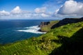 Cliffs of Moher at Alantic Ocean in Western Ireland with waves battering against the rocks