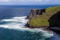 Cliffs of Moher at Alantic Ocean in Western Ireland with waves battering against the rocks Royalty Free Stock Photo