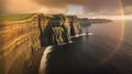 Cliffs of Moher in Ireland at sunset with rainbow