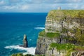 Cliffs of Moher. Landscape with rock in the sea and O`brien`s tower in the distance