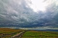 Cliffs of Moher seaside path stone wall and pasture lands overlooking Liscanor Bay Royalty Free Stock Photo