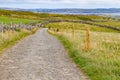 Cliffs of Moher trail with Lahinch and Liscannor in background Royalty Free Stock Photo