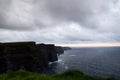 Cliffs of Moher view during cloudy sunset in County Clare, Ireland. Royalty Free Stock Photo