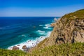 Cliffs and rocks on the Atlantic ocean coast - Praia da Ursa beach