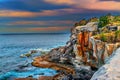 Cliffs and rough sea at sunset