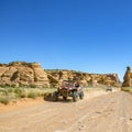 Cliffs and vehicle on an off road trail in Moab Royalty Free Stock Photo