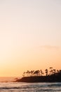 Cliffs and waves in the Pacific Ocean at sunset, in Laguna Beach, Orange County, California