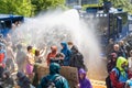 Climate activists from Extinction Rebellion movement blocking the road during protest action, police using water cannon