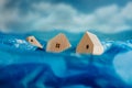 Climate Change Effect, Environment Issue. Conceptual Photo. Wooden Miniature House in Flood. Environmental Impact. Global Issues,