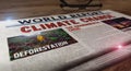 Climate change and environmental crisis newspaper on table