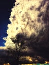 Dramatic sky with upcoming bad weather and black clouds as the sun goes through the clouds and creates the wonderfully colorful sk Royalty Free Stock Photo