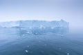 Climate change and global warming. Icebergs from a melting glacier in Greenland. UNESCO