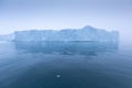 Climate change and global warming. Icebergs from a melting glacier in Greenland. UNESCO