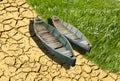 Climate change greenhouse effect boats soil grass Royalty Free Stock Photo